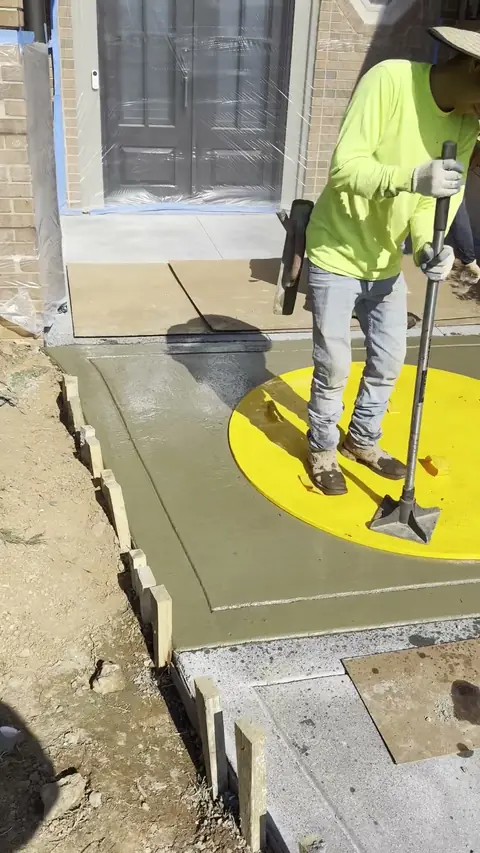 Finishing a new concrete walk at a front entry