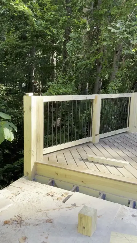 Deck build with new railing and a paver patio below
