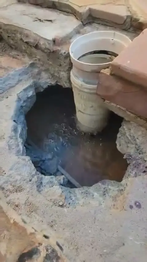 Pool drain and flagstone repair in progress