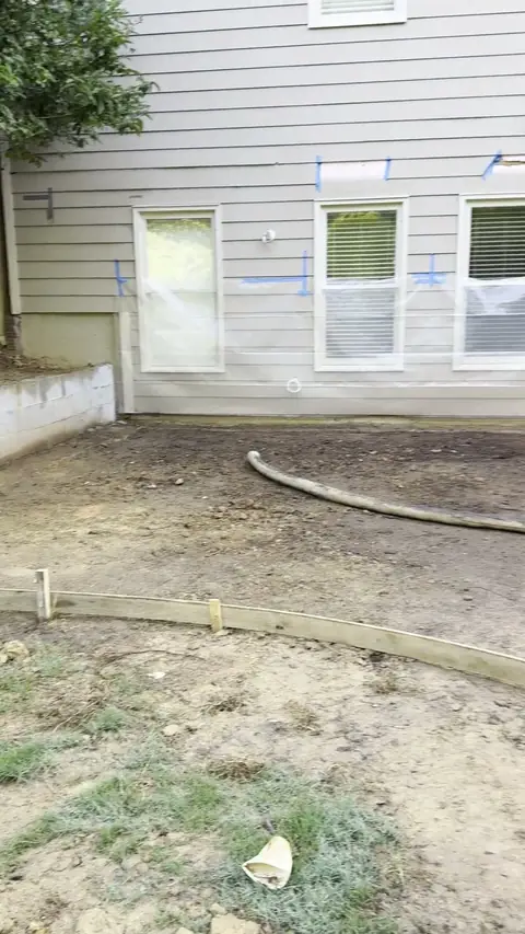 Patio area under a deck formed, with drain pipe in place