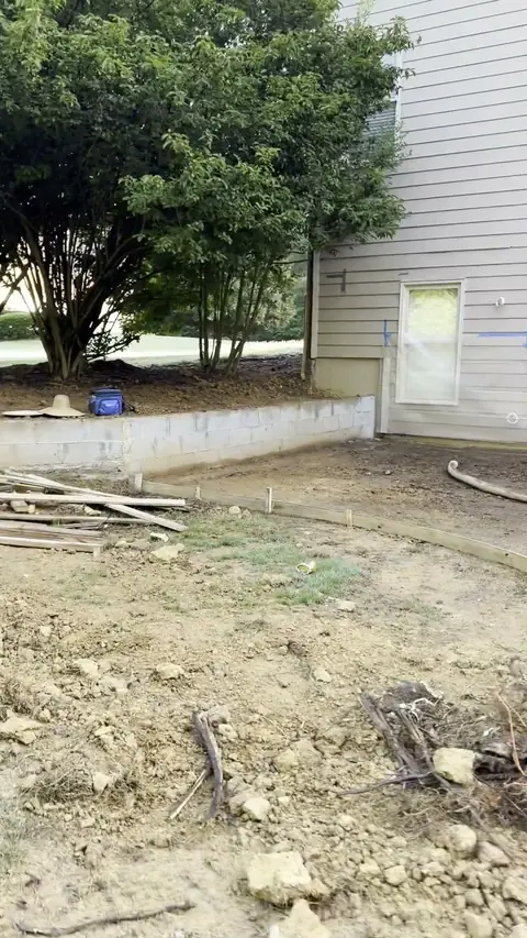 Forms and drainage set for a patio under a deck