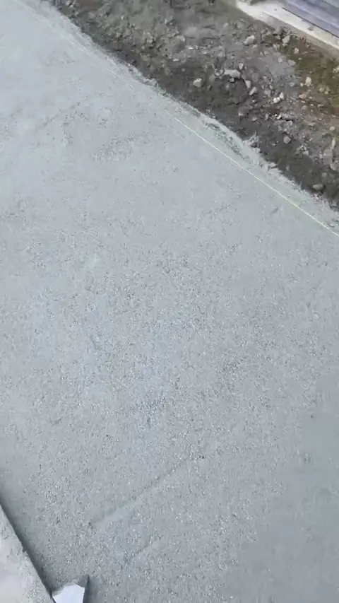 Concrete walkway work beside a pool build