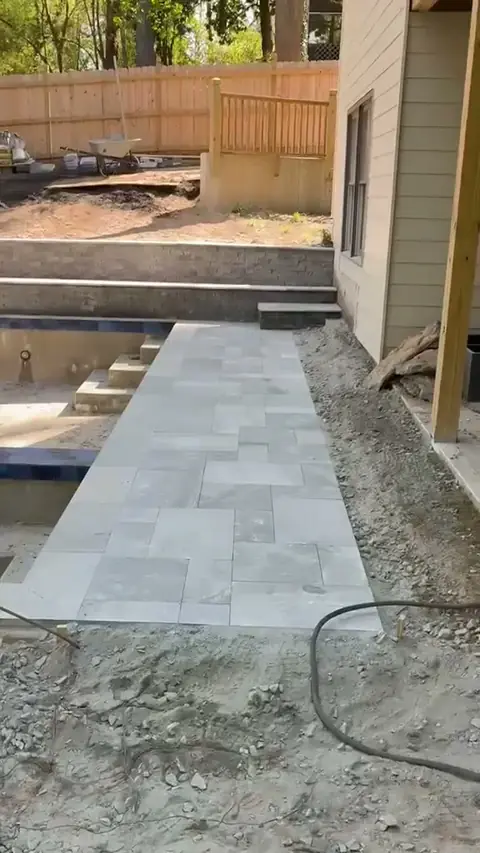 Paver walkway along a pool